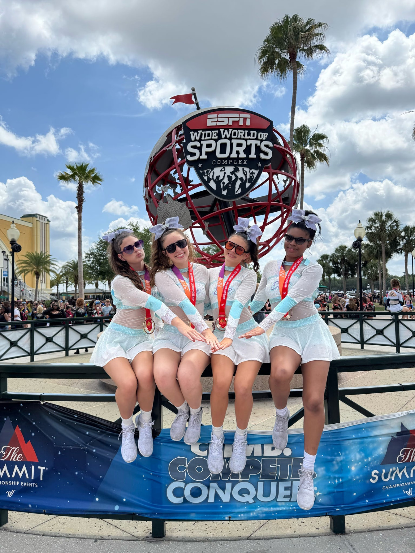 Four Elite Athletics athletes wearing medals at ESPN Wide World of Sports